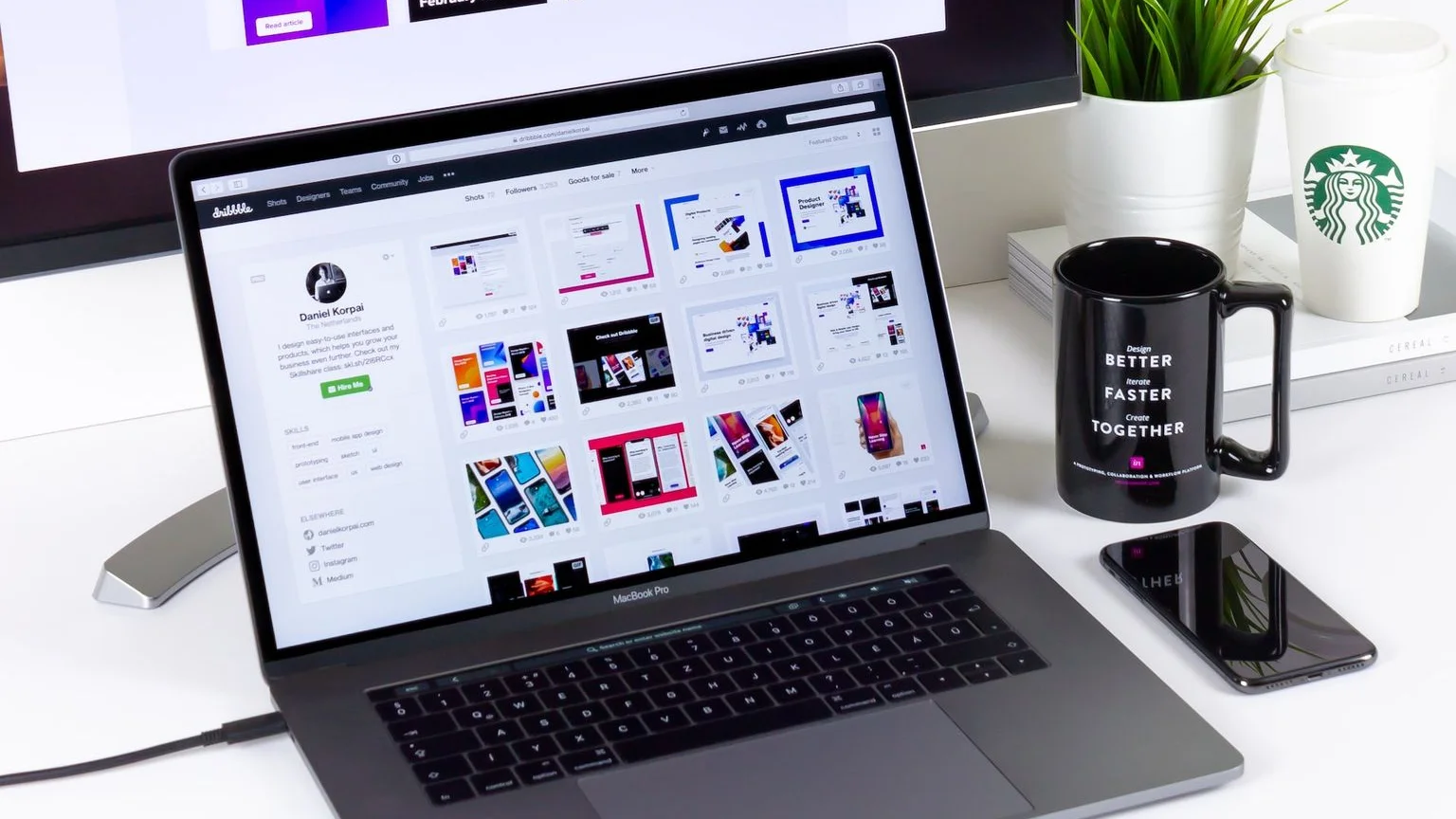black and gray laptop computer beside black mug